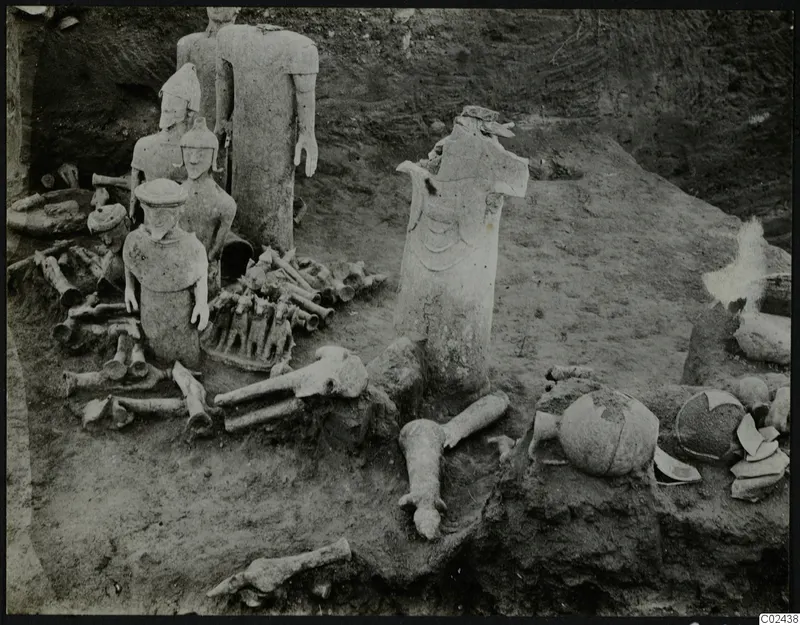 Excavation at Ayia Irini with pale figures and bones found in situ among broken pottery