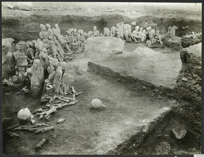 Excavation trench at Ayia Irini with terracotta figures and bones lying in situ