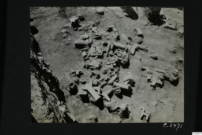 Excavated ground at Ayia Irini, squares K-L 6, with many broken terracotta figurines and fragments lying in situ.