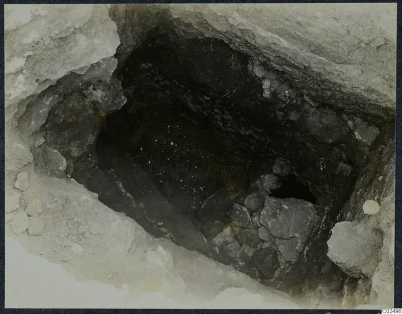 Tomb 12 at Enkomi: view down into the tomb chamber, with stones piled against one side during excavation