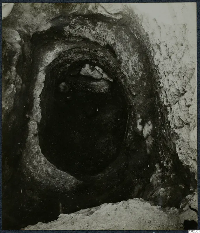 Tomb chamber opening at Enkomi, with stones lying in the entrance during excavation