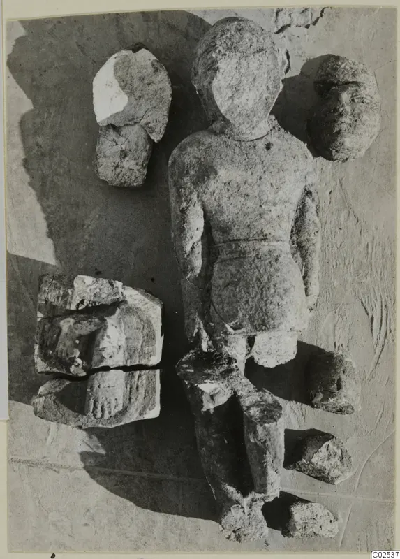 Limestone Cypro-Egyptian statue fragments, with a standing figure and separate heads