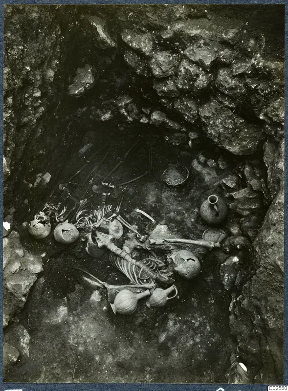 Tomb 14 at Enkomi, tomb chamber with a skeleton and pottery vessels during excavation
