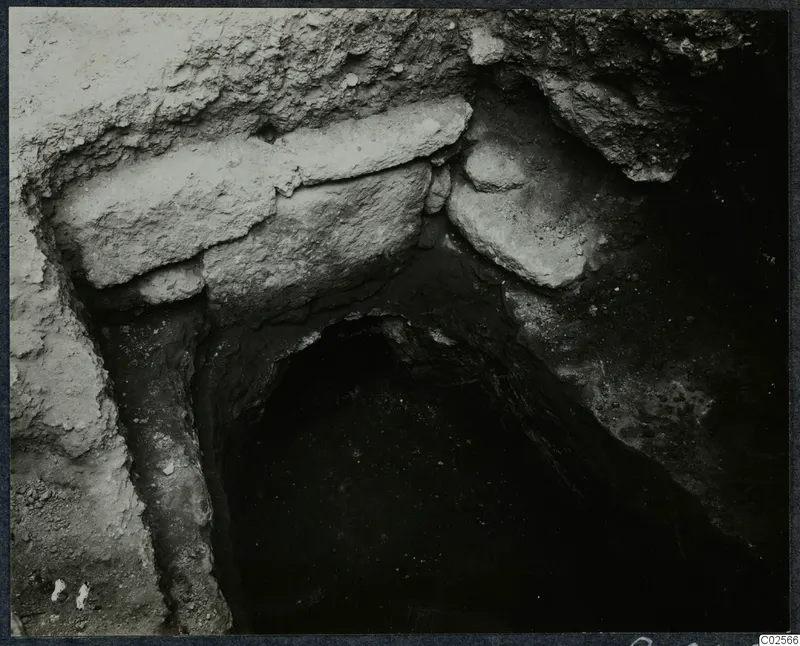 Tomb 7 at Enkomi: stone slabs laid across the entrance of a tomb chamber during excavation