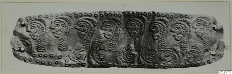 Diadem strip from Enkomi with embossed profile heads and beaded borders, photographed flat