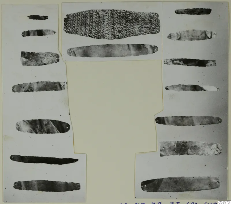 Gold and silver strips with small holes at their ends, mounted on a card, from the Enkomi finds