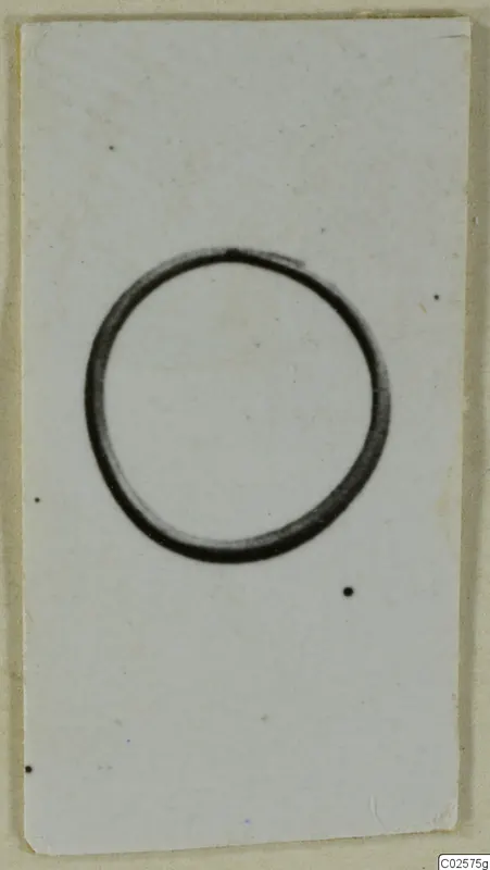 Single dark ring shape on a white card, filed as a find from Enkomi