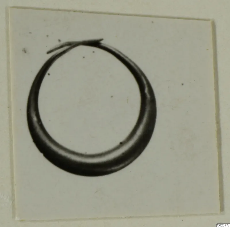 Metal hoop earring from Enkomi with overlapping ends, shown as a single object.
