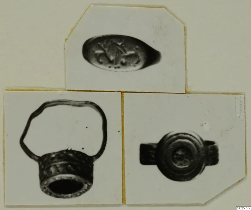 Three photographs on a card mount of finger rings and an oval engraved stone