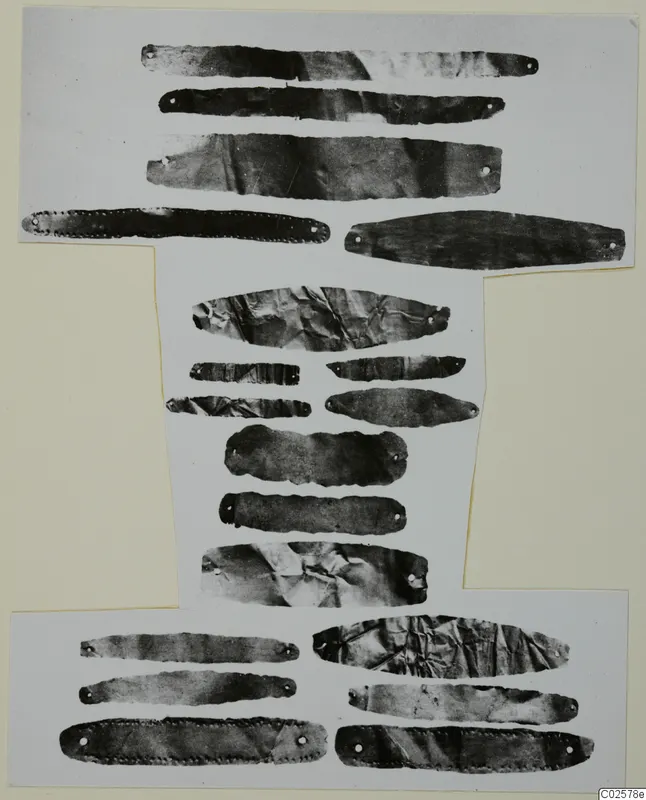 Thin metal strips with punched holes, arranged in rows on a white card mount, Enkomi Bronze Age gold and silver