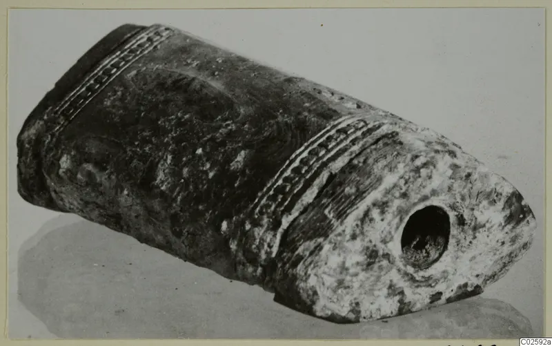 Bone object from Enkomi with incised bands and a round hole in one rounded end