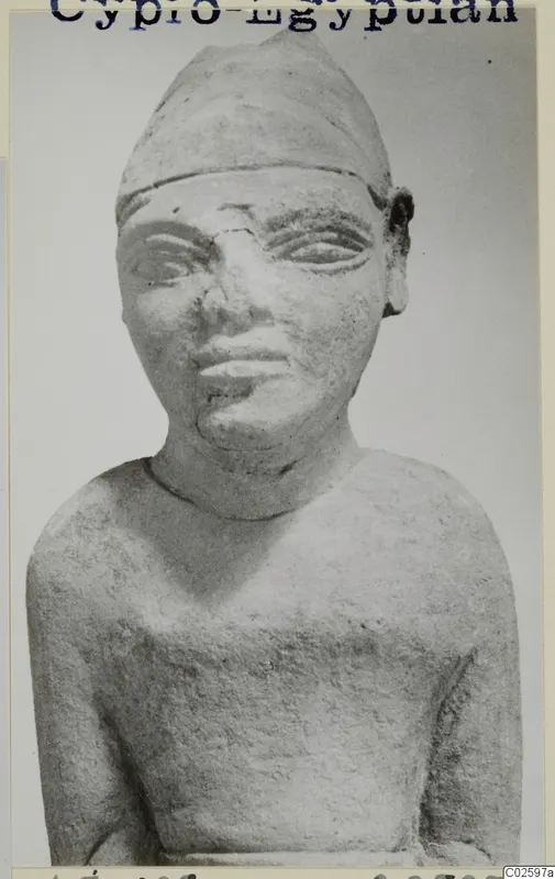 Limestone Cypro-Egyptian statue of a figure in a tall headdress, from Ayia Irini
