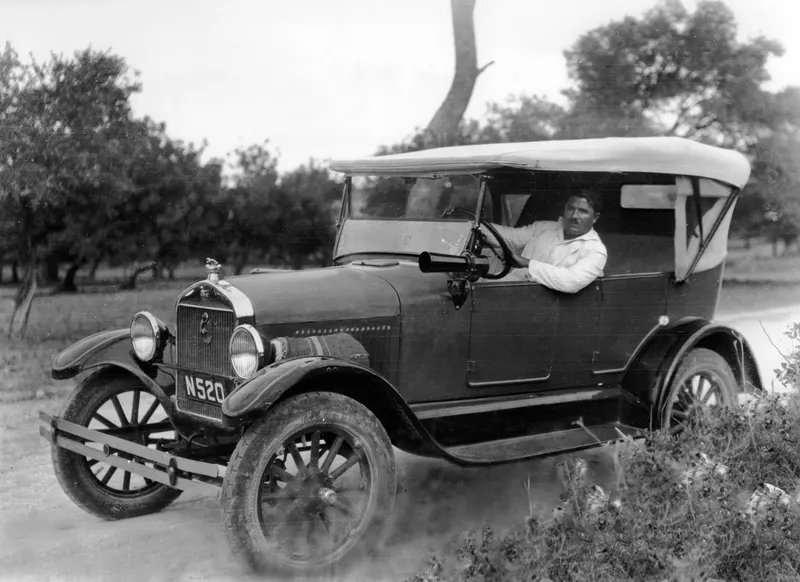 Toulis at the wheel of the Ford car N520 on a dirt road at Kyrenia