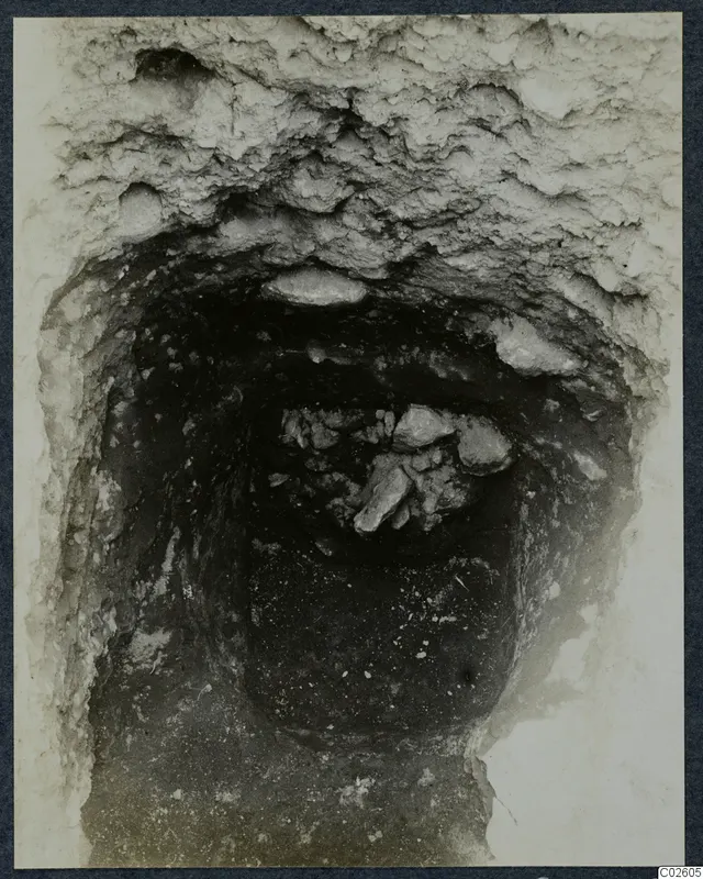 Tomb 11 at Enkomi, looking down into the tomb chamber with stones during excavation