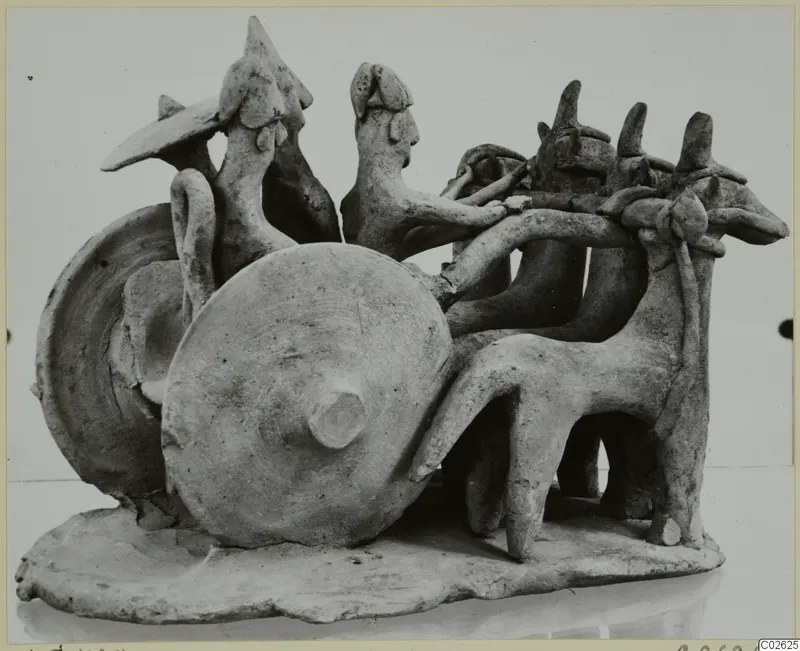 Terracotta group of a two-wheeled vehicle with two riding figures and three harnessed animals, from Ayia Irini