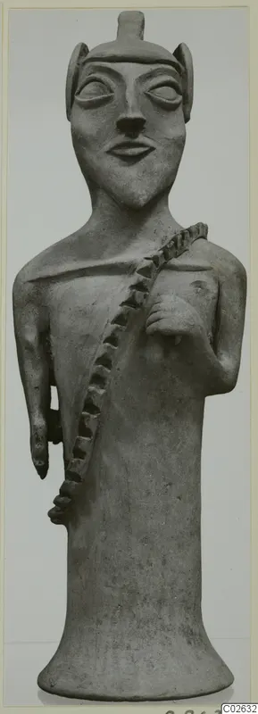 Terracotta figure of a standing human figure with a flared base and a notched band across the chest