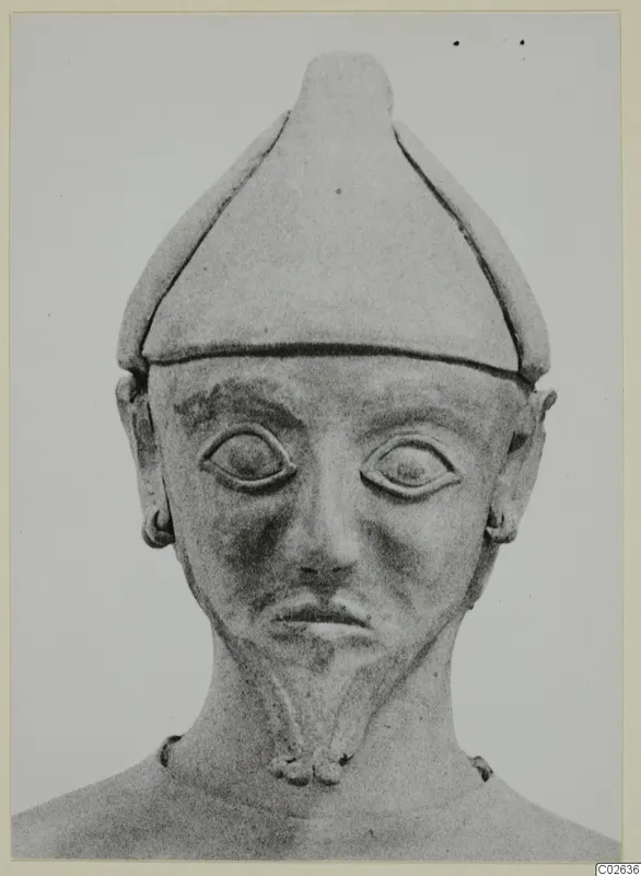 Terracotta Proto-Cypriote I, head and upper body of a figure wearing a tall conical cap, seen from the front