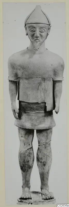 Standing terracotta figure with a pointed cap and beard, from Ayia Irini