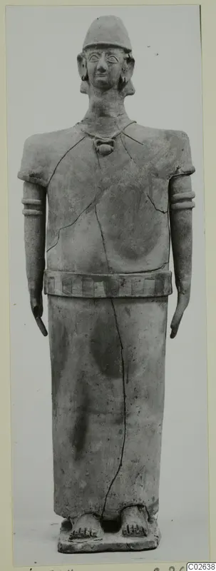 Terracotta figure of a standing human figure in a cap and necklace, from Ayia Irini