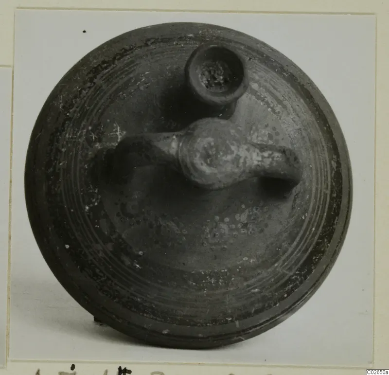 Levanto-Helladic bowl-jar seen from above, with a horizontal handle and a small spout on its dark surface