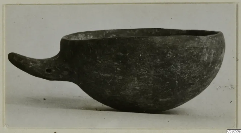 Black-slipped pottery bowl with a long handle, from Ayios Iakovos