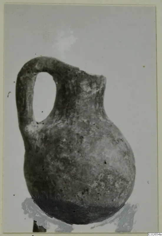 Pottery Red Polished IV jug with a single loop handle, from Ayios Iakovos