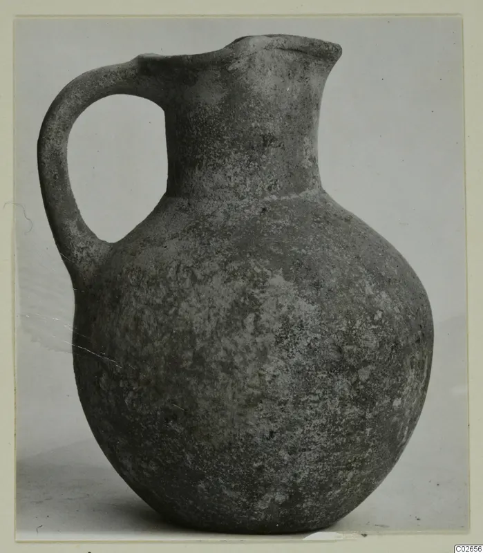Wheel-made bucchero jug with a single loop handle, Ayios Iakovos find
