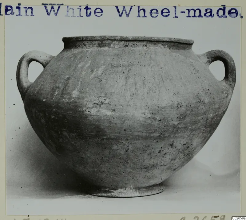 Plain White Wheel-made two-handled pot from Ayios Iakovos, shown from the side