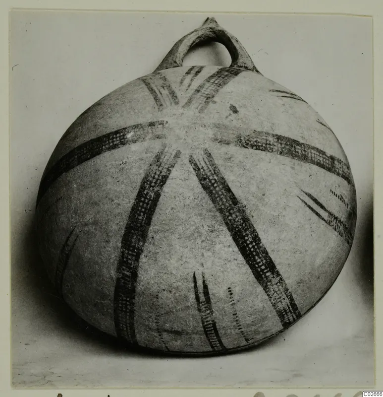 Round vessel with a loop handle and dark radiating painted bands, from Ayios Iakovos