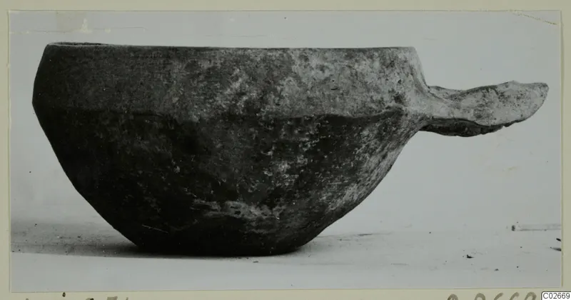 Pottery Monochrome Ware bowl with a flat side handle, from Ayios Iakovos