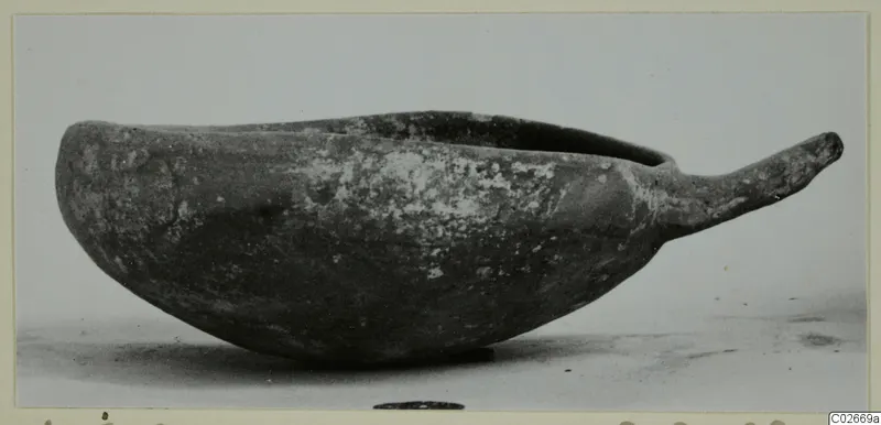 Pottery bowl with a long handle, side view, from Ayios Iakovos.