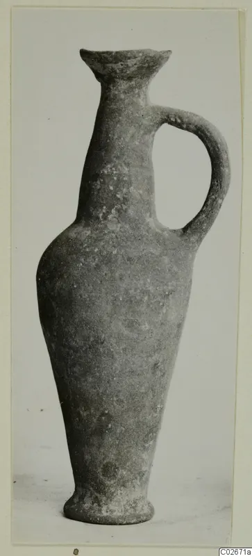 Base-Ring Ware bottle with a flared rim, tall neck and single loop handle, seen from the front