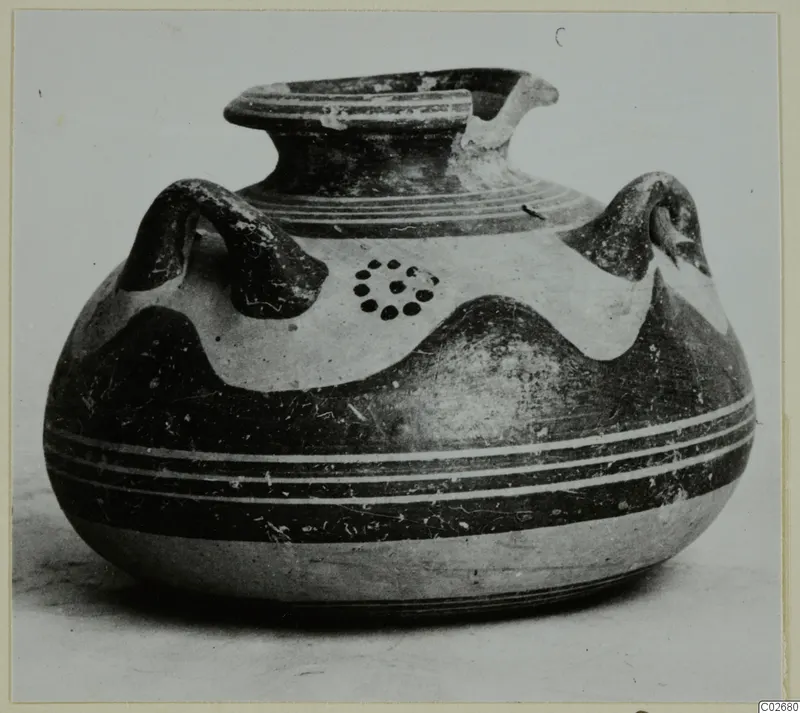 Pottery vessel with two handles, a flared rim and dark painted bands, from Ayios Iakovos