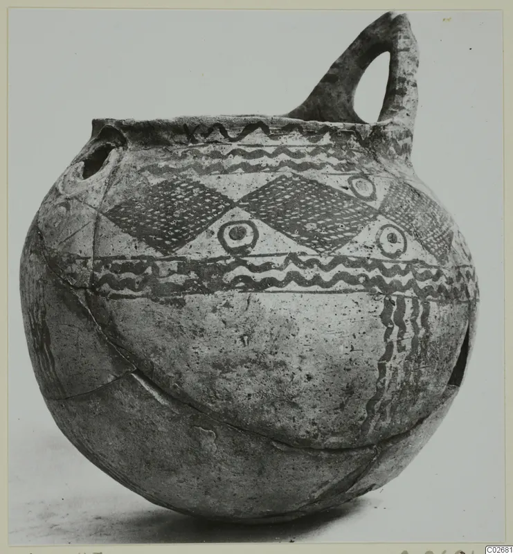 Pottery White Painted IV-V jug with a loop handle, painted wavy bands and diamond-lattice panels