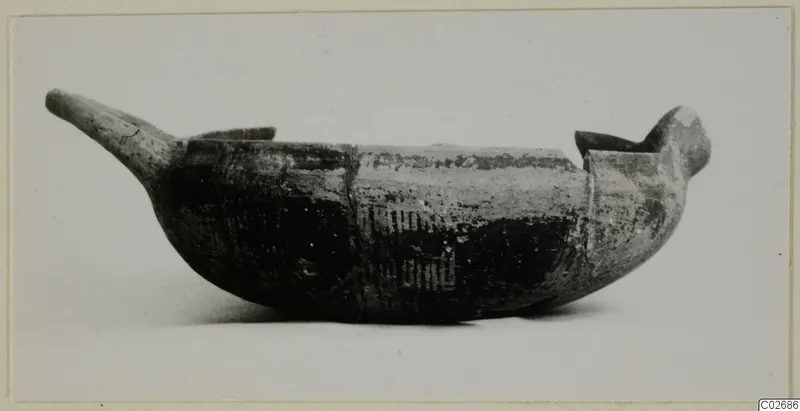 Elongated pottery bowl with projecting ends and painted vertical bands, shown on a plain background