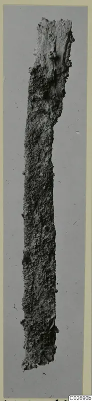 Corroded iron knife blade, long and narrow, from the Marion tomb finds