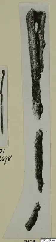 Corroded iron tools from Marion Tomb 9, shown in two photographs on a card mount.