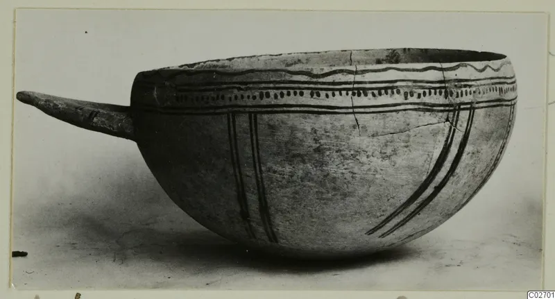 Pottery White Slip Ware bowl with a side handle and black painted bands, from Ayios Iakovos