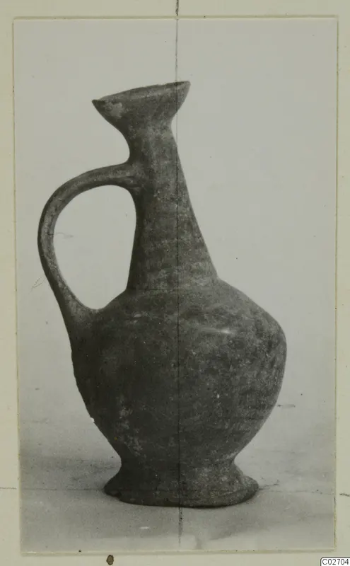 Pottery jug of Base-Ring Ware with a single loop handle and flared mouth, from Ayios Iakovos