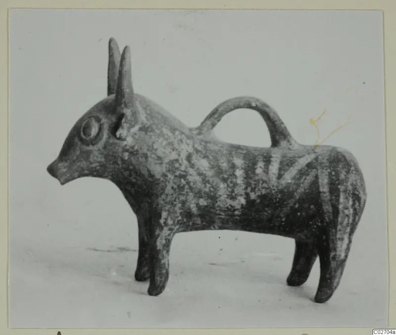 Pottery Base-Ring Ware vessel shaped as a horned animal, with a loop handle arching over its back