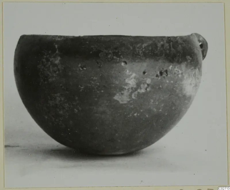 Red Polished II bowl with a small handle, from Lapithos, shown in side view
