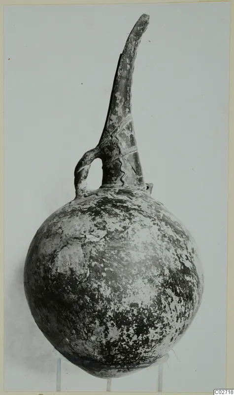 Red Polished II jug from Lapithos, Vrysi tou Barba tombs, with a tall neck and single loop handle