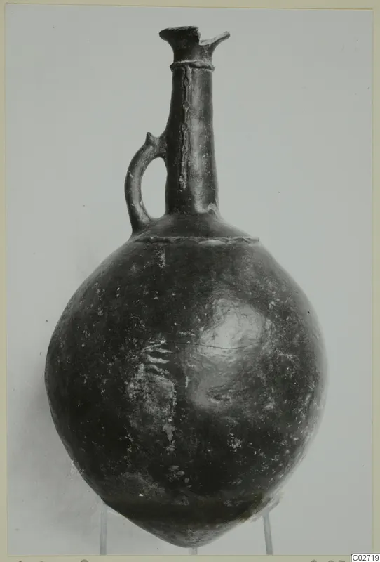 Red Polished II jug with a single loop handle, from the Vrysi tou Barba tombs at Lapithos