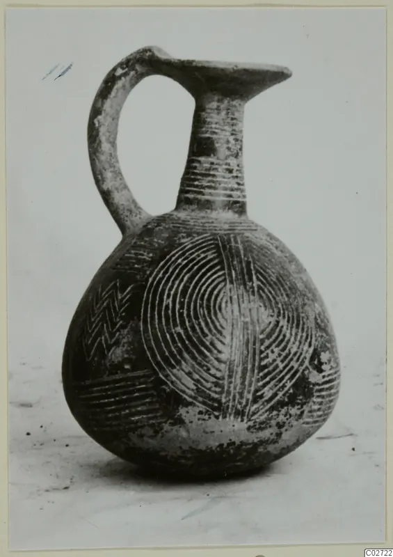 Red Polished II jug from Lapithos with incised arcs, chevrons and horizontal lines on its body