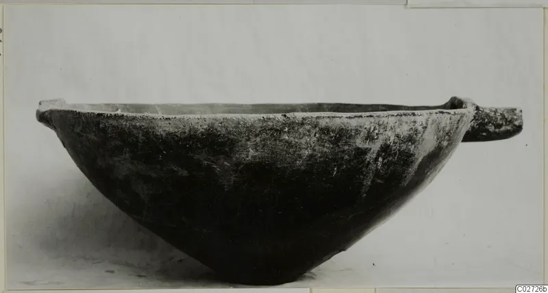 Red Polished III bowl with a horizontal handle, seen from the side against a plain light background