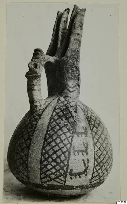 Pottery vessel from Ayios Iakovos with two tall spouts, a tubular handle and painted lattice and band decoration