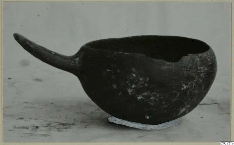 Pottery bowl with a long tapering handle, Red Polished IV ware
