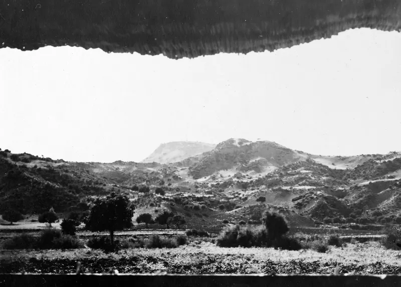 View over scrubby hills and scattered trees toward Vouni, seen from the tent at Mersinaki