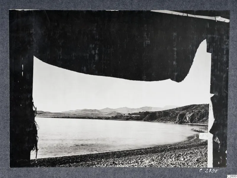 View through a bast tent at Mersinaki across a bay towards hills near Soli