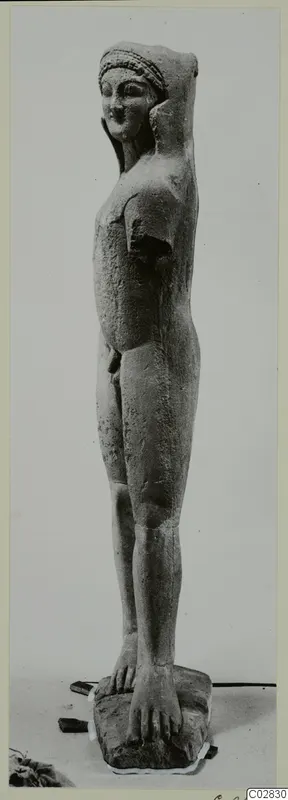 Limestone statue of a standing nude figure from Kition, with a damaged head and arm